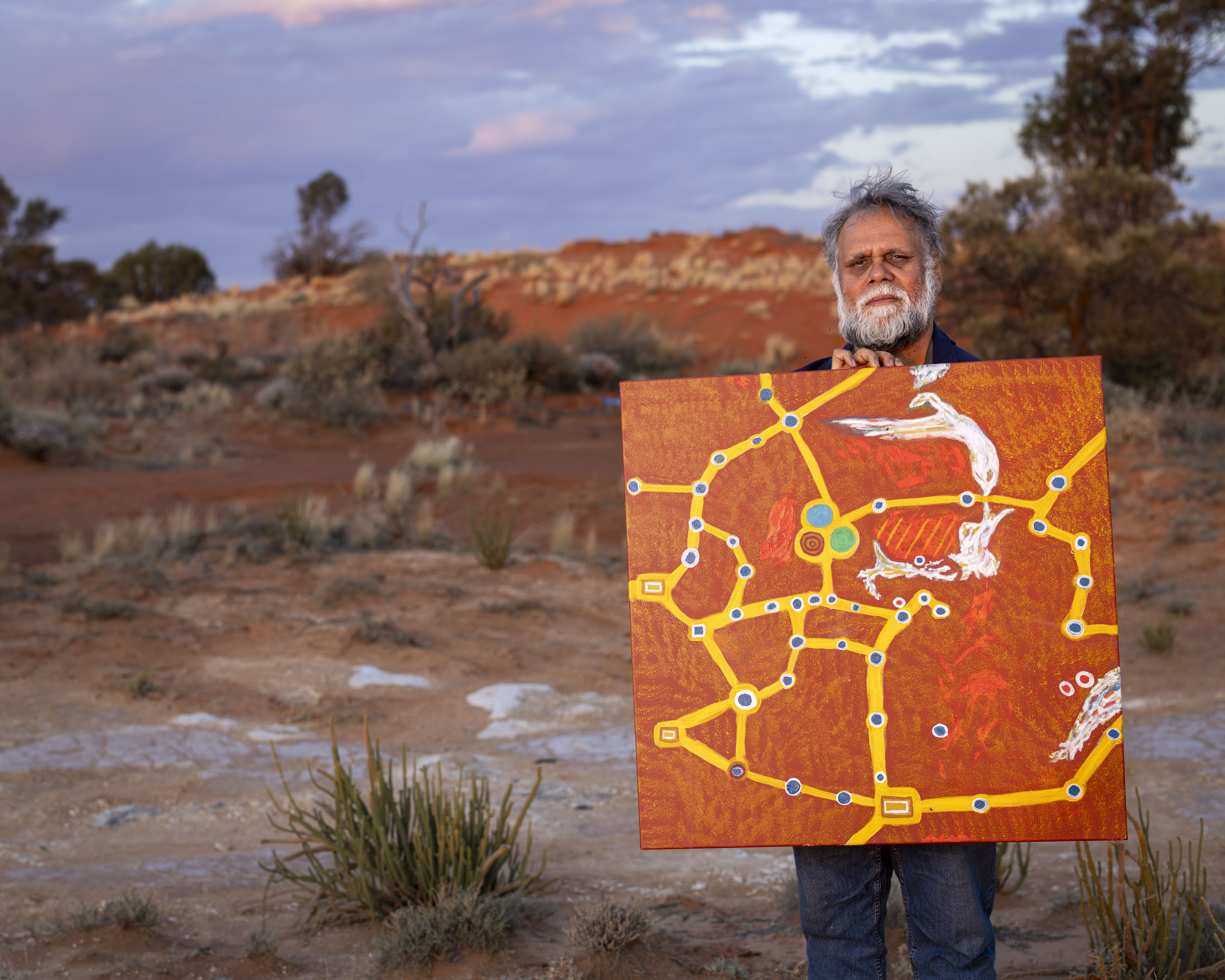 Ngalia Country with traditional artwork pathways representing connection to land, culture, and ancestral knowledge